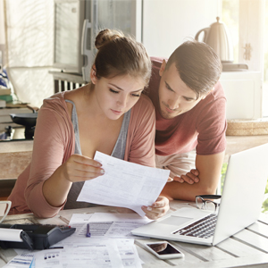 Financial Advice for Married Couples Married couple looking at finances